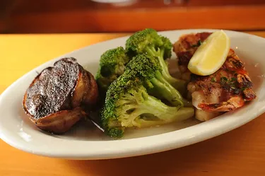 Bacon-wrapped filet with broccoli and grilled shrimp