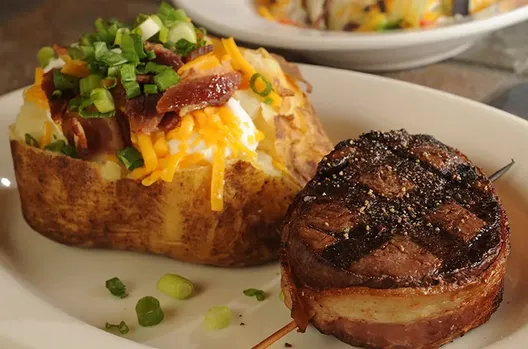 Bacon-wrapped filet with loaded baked potato